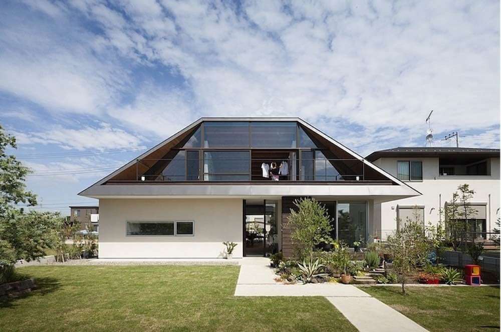 Hip Roof on a Contemporary Home with White Stucco Siding