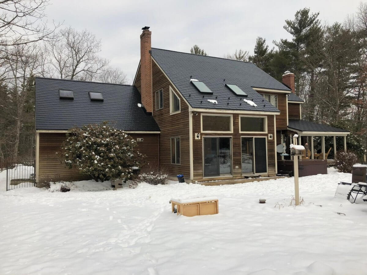 Metal roof fights ice dams and snow